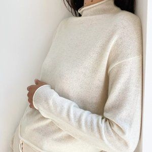 ISO Aritzia Cusp Turtleneck in Cream sz M